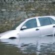 What should be done to save a life from a sinking car?
